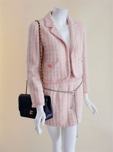 pink and black chanel|Chanel pink tweed suit.